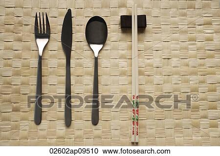 Stock Image - fork, knife, spoon and chopstick dinner setting. Fotosearch