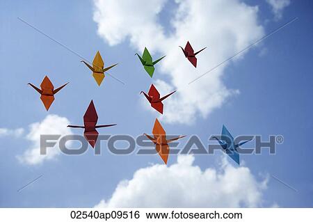 multiple paper cranes against sky backdrop View Large Photo Image Stock Photograph - multiple paper cranes against sky backdrop. Fotosearch