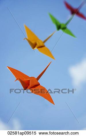 multiple paper cranes against sky backdrop View Large Photo Image Stock Photography - multiple paper cranes against sky backdrop. Fotosearch