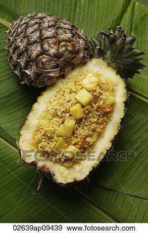 pineapple rice in fruit shell on banana leaf View Large Photo Image Stock Photo - pineapple rice in fruit shell on banana leaf. Fotosearch