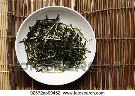 seaweed shreds in a white bowl View Large Photo Image Stock Image - seaweed shreds in a white bowl. Fotosearch