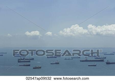 Stock Image - Ships in Singapore port in the morning. Fotosearch