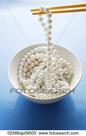 string of pearls on chopstick View Large Photo Image Stock Image - string of pearls on chopstick. Fotosearch