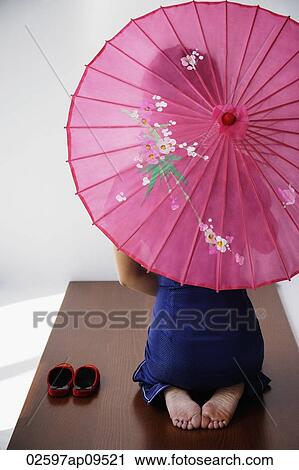 young Chinese woman in blue cheongsam holding pink umbrella View Large Photo Image Stock Image - young Chinese woman in blue cheongsam holding pink umbrella. Fotosearch