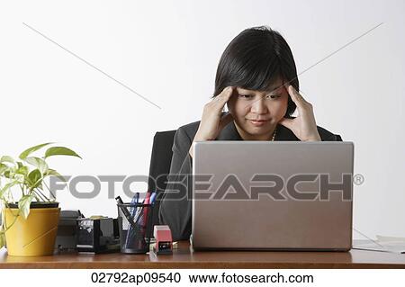 business woman looking stressed at computer View Large Photo Image Stock Image - business woman looking stressed at computer. Fotosearch