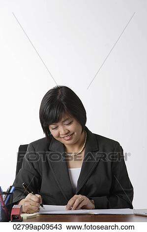 business woman working at desk View Large Photo Image Stock Image - business woman working at desk. Fotosearch