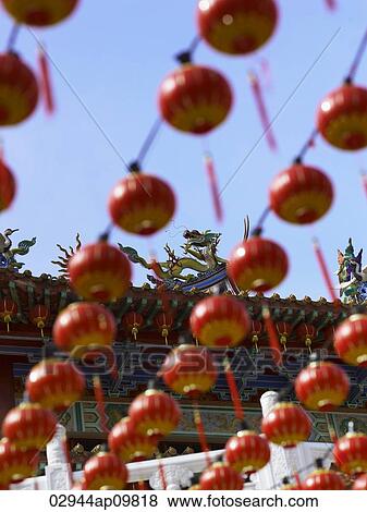 Chinese lanterns hanging in a line View Large Photo Image Stock Photo - Chinese lanterns hanging in a line. Fotosearch