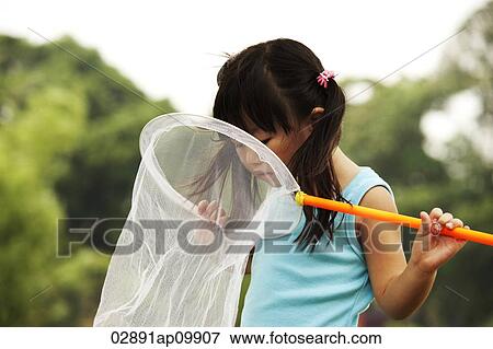 girl looking into butterfly net View Large Photo Image Stock Photo - girl looking into butterfly net. Fotosearch