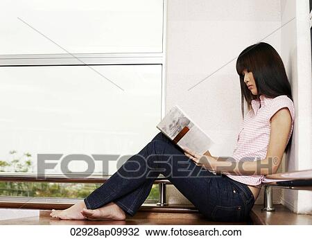 girl sitting on floor reading View Large Photo Image Stock Image - girl sitting on floor reading. Fotosearch