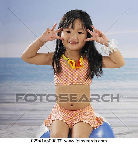 girl smiling at camera in bathing suit View Large Photo Image Stock Photo - girl smiling at camera in bathing suit. Fotosearch