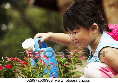 girl watering flowers View Large Photo Image Stock Photo - girl watering flowers. Fotosearch