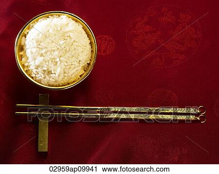 golden rice bowl with rice and chopsticks View Large Photo Image Stock Image - golden rice bowl with rice and chopsticks. Fotosearch