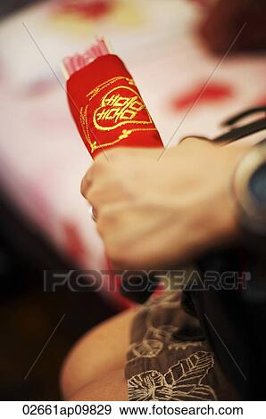 Hand holding Chinese wedding gift View Large Photo Image Stock Photo - Hand holding Chinese wedding gift. Fotosearch