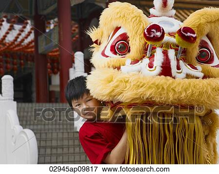 Little boy with Chinese lion dance costume View Large Photo Image Stock Photo - Little boy with Chinese lion dance costume. Fotosearch