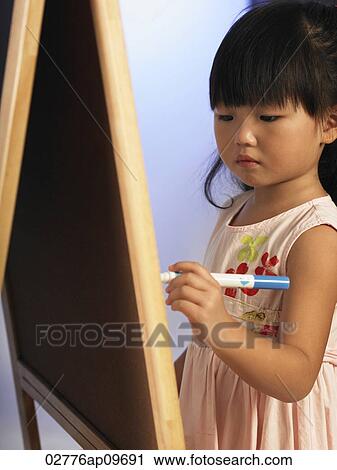 Stock Image - little girl drawing. Fotosearch