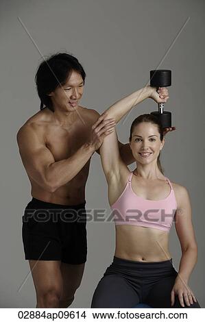 man and woman with free weight View Large Photo Image Picture - man and woman with free weight. Fotosearch