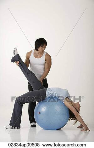 Stock Photo - Man and woman working out. Fotosearch