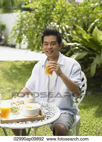 man having breakfast outside View Large Photo Image Stock Image - man having breakfast outside. Fotosearch