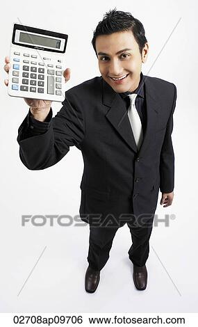 "man holding up calculator, smiling" View Large Photo Image Stock Photograph - "man holding up calculator, smiling". Fotosearch