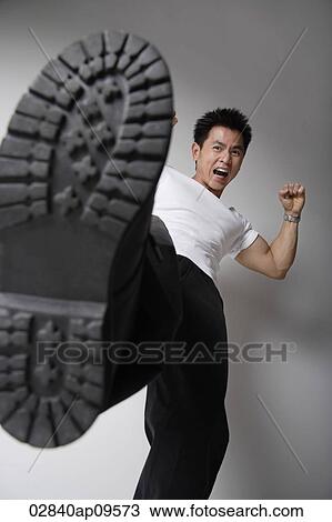 man kicking at camera View Large Photo Image Stock Image - man kicking at camera. Fotosearch