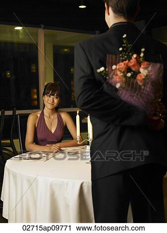 man surprising woman with flowers View Large Photo Image Stock Image - man surprising woman with flowers. Fotosearch