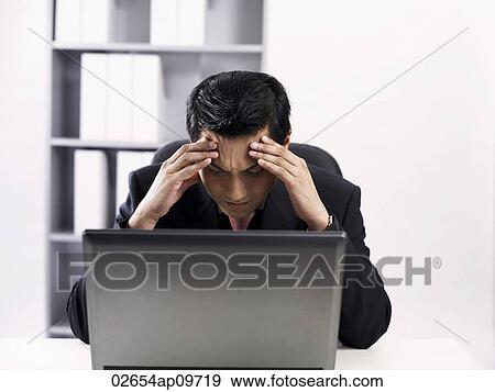 man using laptop feeling stressed up View Large Photo Image Stock Photo - man using laptop feeling stressed up. Fotosearch