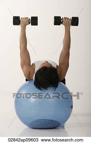 Man working out View Large Photo Image Stock Image - Man working out. Fotosearch