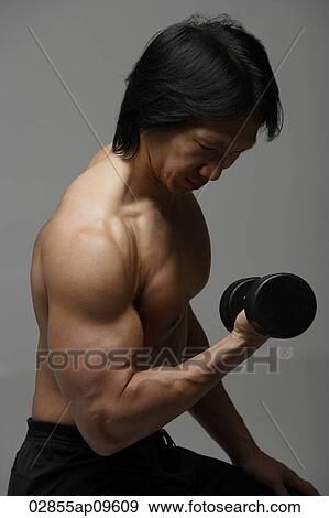 Man working out with free weight View Large Photo Image Stock Photo - Man working out with free weight. Fotosearch