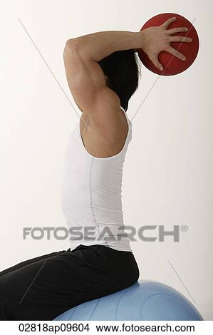 Man working out with medicine ball View Large Photo Image Picture - Man working out with medicine ball. Fotosearch