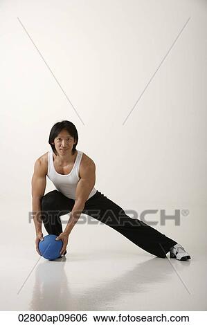 Man working out with medicine ball View Large Photo Image Stock Photograph - Man working out with medicine ball. Fotosearch
