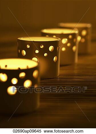tea light holders lit up View Large Photo Image Stock Photography - tea light holders lit up. Fotosearch