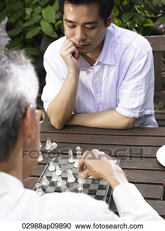 two men playing chess View Large Photo Image Stock Image - two men playing chess. Fotosearch