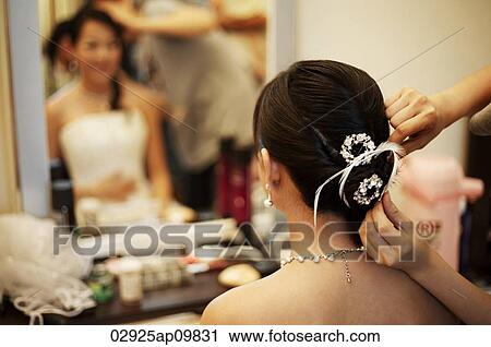Woman getting hair done View Large Photo Image Stock Image - Woman getting hair done. Fotosearch