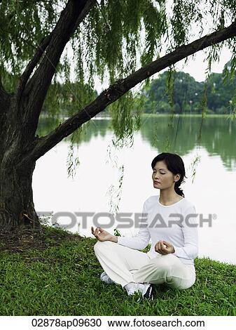 woman meditating outdoors View Large Photo Image Stock Image - woman meditating outdoors. Fotosearch
