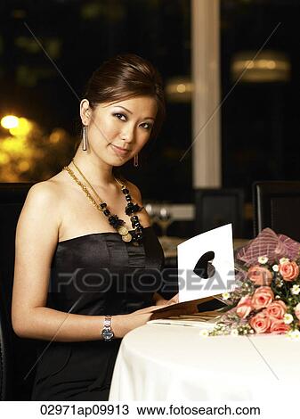 woman sitting in restaurant View Large Photo Image Stock Image - woman sitting in restaurant. Fotosearch