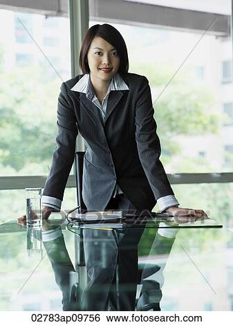 woman standing at desk View Large Photo Image Stock Photograph - woman standing at desk. Fotosearch