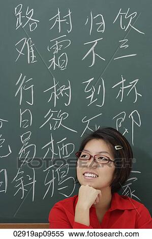 woman standing in front of chinese characters written in chalk View Large Photo Image Stock Photography - woman standing in front of chinese characters written in chalk. Fotosearch