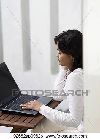 woman using laptop View Large Photo Image Stock Photography - woman using laptop. Fotosearch