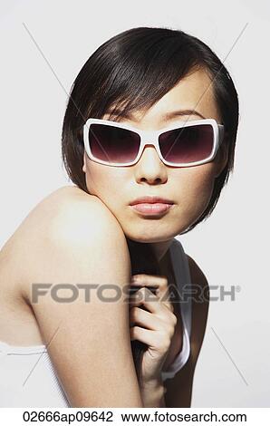 woman wearing over sized sunglasses View Large Photo Image Stock Image - woman wearing over sized sunglasses. Fotosearch