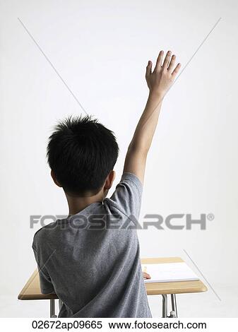 young boy raising his hand View Large Photo Image Stock Photography - young boy raising his hand. Fotosearch