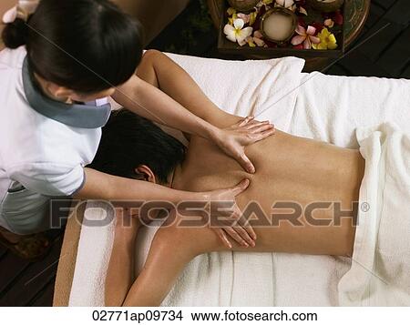 young man getting a back massage View Large Photo Image Picture - young man getting a back massage. Fotosearch