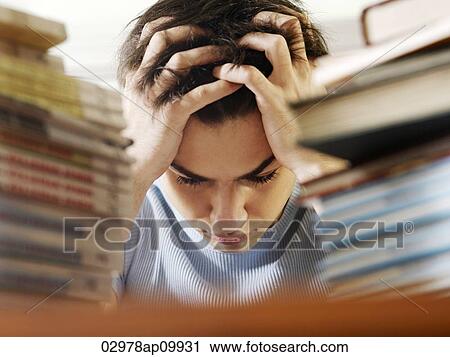 young man stressed while studying View Large Photo Image Stock Image - young man stressed while studying. Fotosearch
