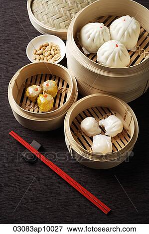 Assortment of dim sum in bamboo steamers. View Large Photo Image Stock Photo - Assortment of dim sum in bamboo steamers.. Fotosearch