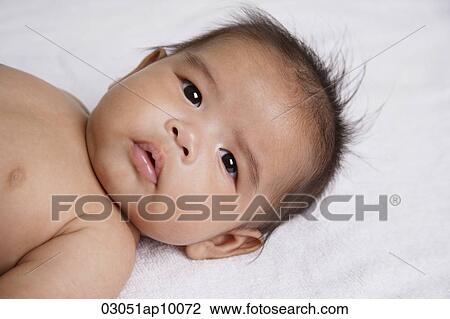 Chinese baby looking at camera View Large Photo Image Stock Image - Chinese baby looking at camera. Fotosearch