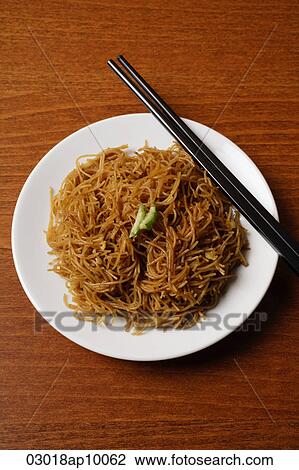 Chinese noodles with chopsticks. View Large Photo Image Stock Image - Chinese noodles with chopsticks.. Fotosearch