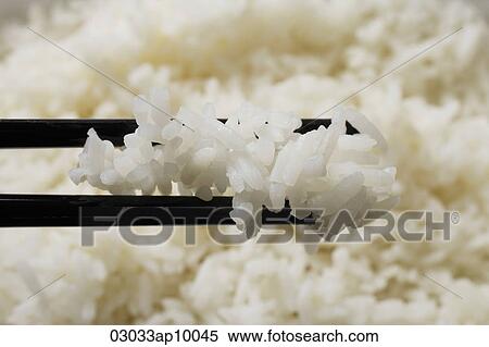close up chopstick holding rice View Large Photo Image Stock Photography - close up chopstick holding rice. Fotosearch