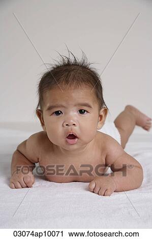 Cut Chinese baby laying on tummy, looking at camera View Large Photo Image Stock Image - Cut Chinese baby laying on tummy, looking at camera. Fotosearch