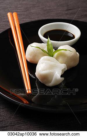 dim sum on plate with orange chopsticks View Large Photo Image Stock Photograph - dim sum on plate with orange chopsticks. Fotosearch