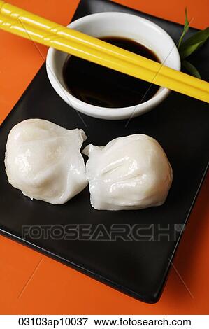 Dim sum on plate with soy sauce View Large Photo Image Stock Photo - Dim sum on plate with soy sauce. Fotosearch