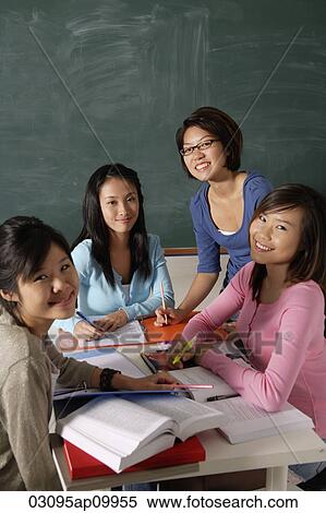 Four young women studying together. View Large Photo Image Stock Photography - Four young women studying together.. Fotosearch